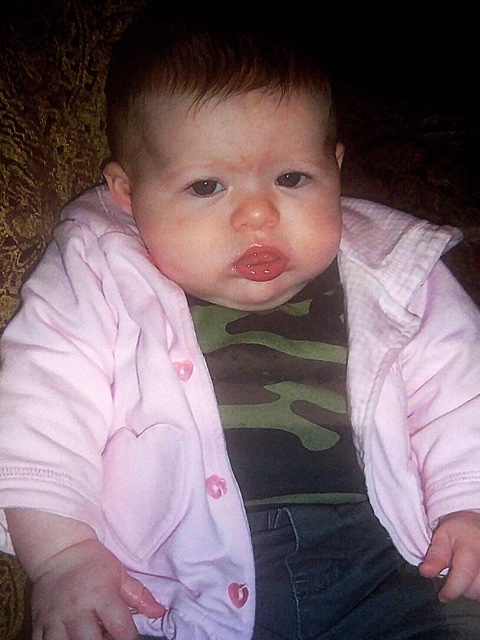 Baby sporting camo with pink sweatshirt