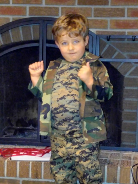 Happy customer sporting a complete set of kids’BDUs in camo